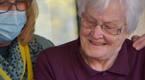 older woman getting support