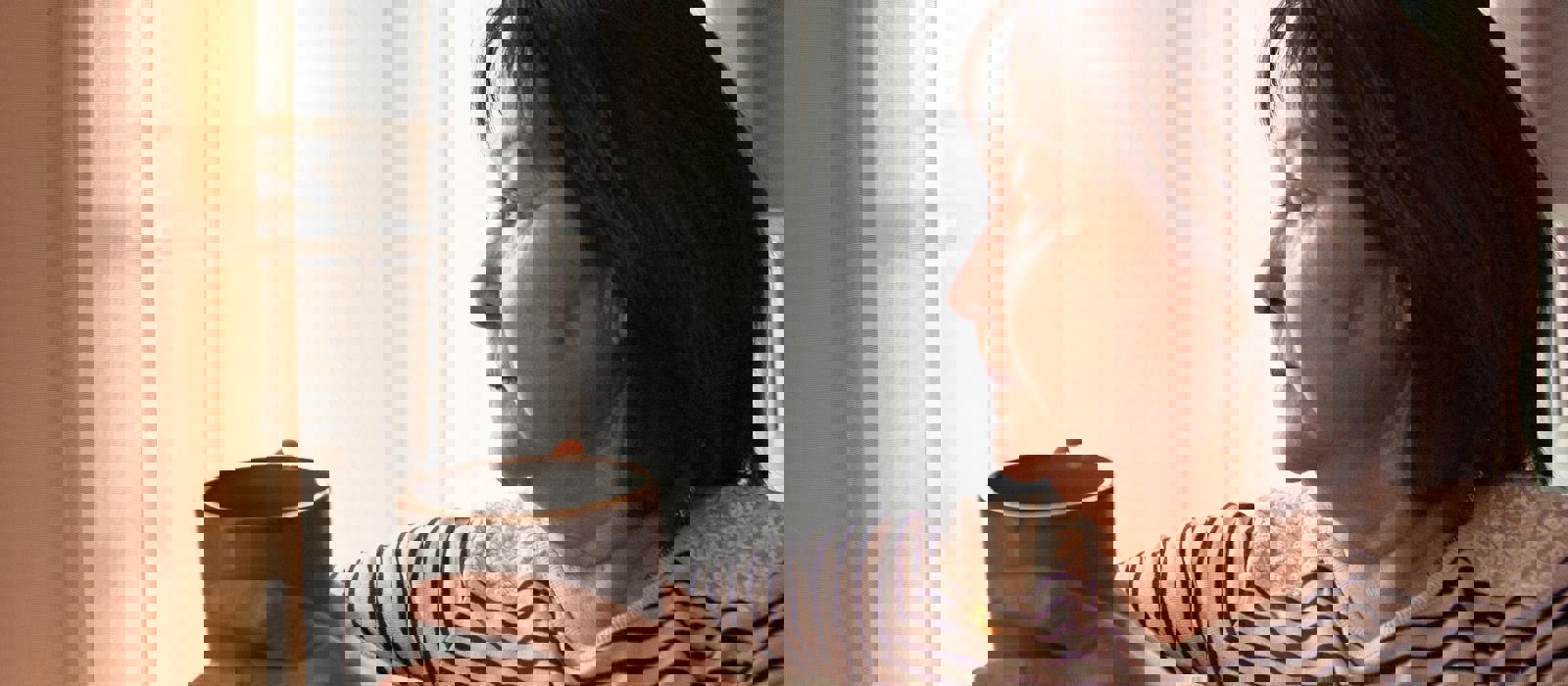 older woman looking out of window